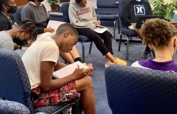 Students participating in speech and debate training programs to improve public speaking and leadership